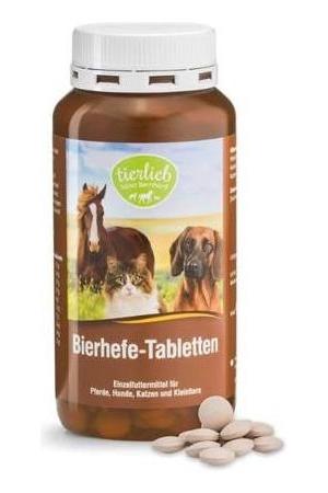 Tierlieb Brewer's Yeast tablets for dogs, cats, and horses in a brown bottle with tablets beside it.