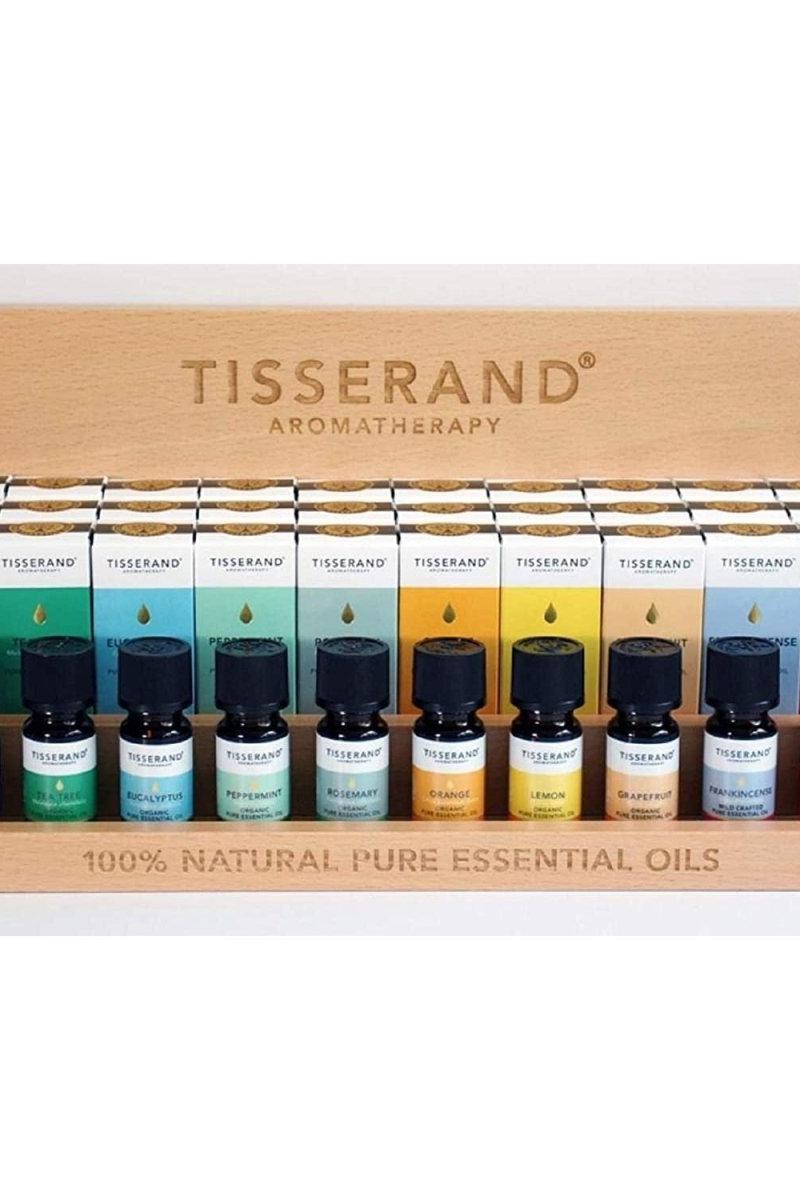 Tisserand Aromatherapy essential oils display case featuring 10 natural oils in elegant wooden holder.