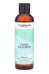Tisserand Aromatherapy Total De-Stress Bath Oil with geranium, orange, and nutmeg for relaxation.