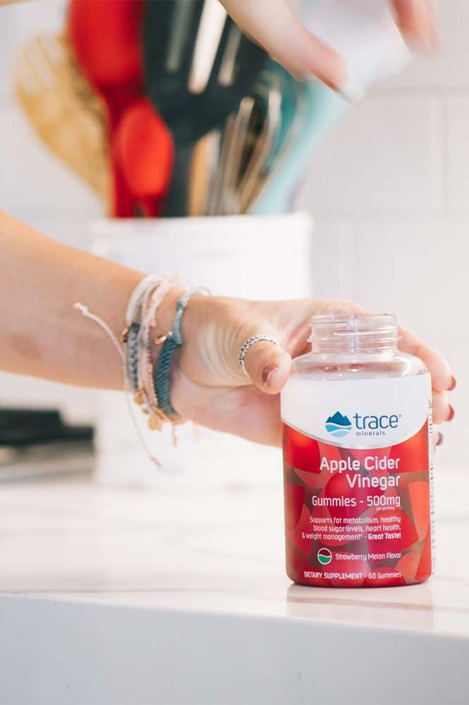Trace Minerals Apple Cider Vinegar gummies in a hand, gluten-free and vegan, flavored with strawberry watermelon. Trace Minerals Apple Cider Vinegar gummies in a hand, gluten-free and vegan, flavored with strawberry watermelon.