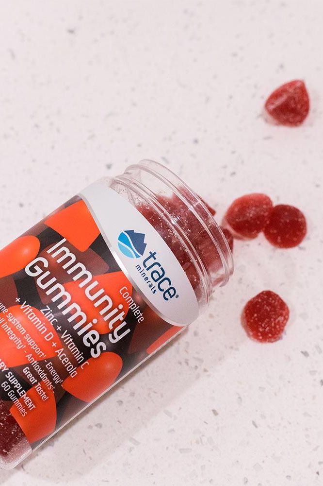 Trace Minerals Immunity Gummies bottle with red gummies on a countertop, supporting a healthy immune system. Trace Minerals Immunity Gummies bottle with red gummies on a countertop, supporting a healthy immune system.