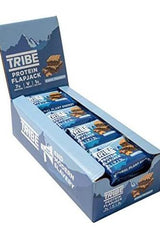 TRIBE Protein Flapjack box display featuring vegan plant energy bars with 7g plant protein and gluten-free ingredients.