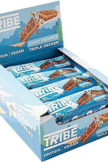 Tribe Choc Peanut Triple Decker protein bars in a display box, vegan, high protein, low sugar snack.