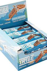 Tribe Choc Peanut Triple Decker protein bars in a display box, vegan, high protein, low sugar snack.