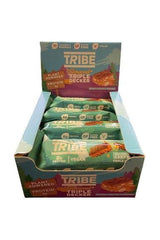 Tribe Triple Decker nut butter bars in a colorful box, showcasing their layers and vegan ingredients.