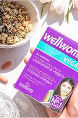 Vitabiotics Wellwoman Vegan supplement box highlighting 24 nutrients for vegetarians and vegans, ideal for women's health.