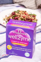 Vitabiotics Wellzyme Digestive Enzymes Advanced Formula box with salad in the background, promoting digestive health.