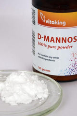 Vitaking D-Mannose 100% pure powder in jar with powder on a plate, 100 grams package.