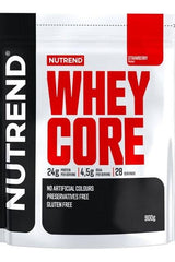 NUTREND Whey Core protein powder packaging, strawberry flavor, 24g protein per serving, gluten-free, 900g bag.