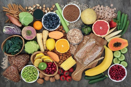 A colorful variety of fruits, vegetables, seeds, and grains showcasing healthy fiber-rich foods.