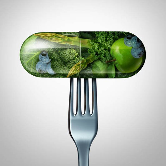 Illustration of a vegetable-filled capsule on a fork, symbolizing nutritional supplements and healthy eating.