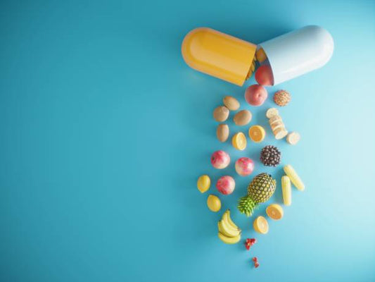 Illustration of a large capsule spilling out various fruits and nuts on a blue background, symbolizing dietary supplements.