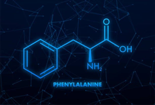 Chemical structure of phenylalanine illustrated in blue against a dark background.