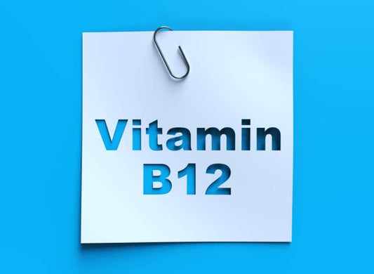 Vitamin B12 note with a clip on a blue background, emphasizing its importance for health and wellness.