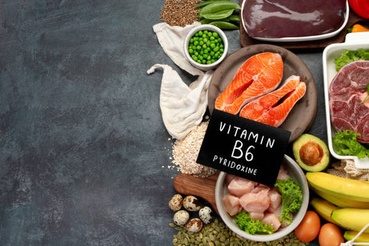 Healthy foods rich in Vitamin B6, including salmon, chicken, greens, and grains.