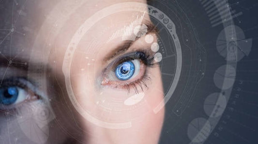 Close-up of a woman's eye with blue iris and digital enhancements, highlighting eye health and vision.