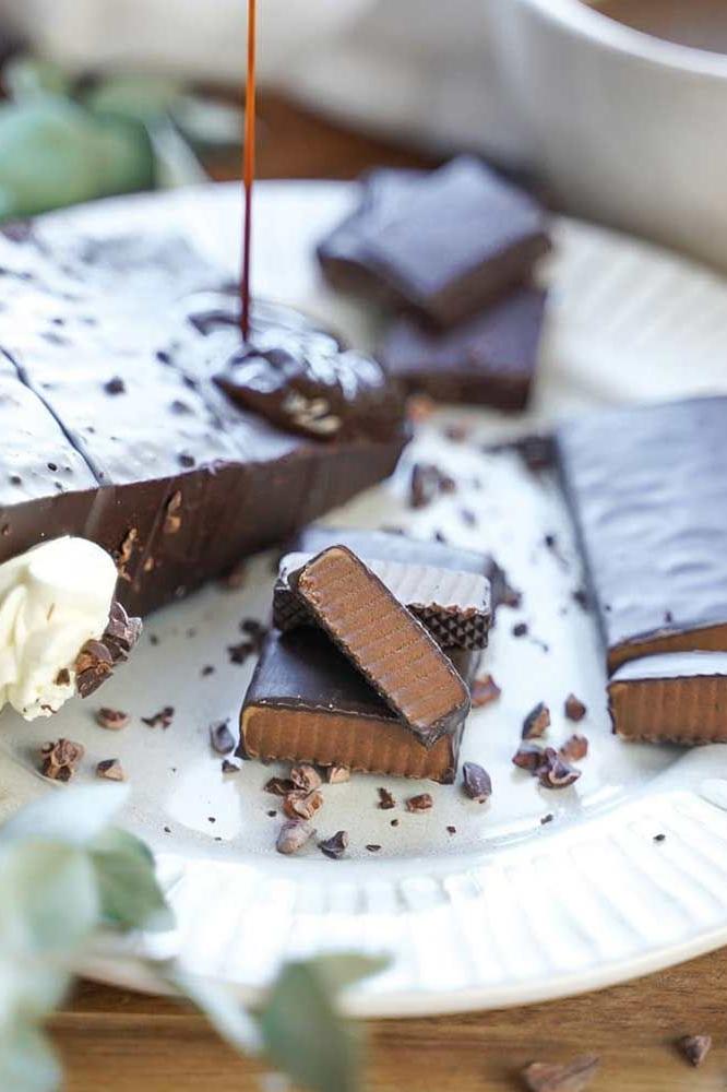 Close-up of AbsoRICE Move Bar pieces drizzled with chocolate on a white plate.