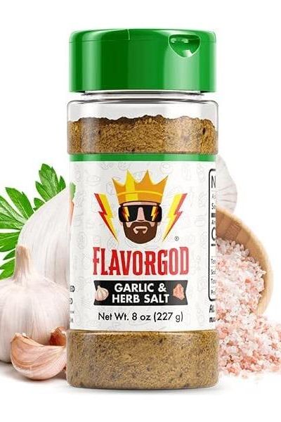 FlavorGod Garlic Herb Salt seasoning bottle with garlic and herbs, enhancing flavor in cooking.