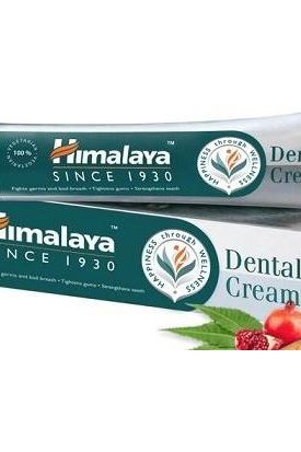 Himalaya Ayurvedic Dental Cream packaging showcasing natural ingredients for healthy teeth and gums.