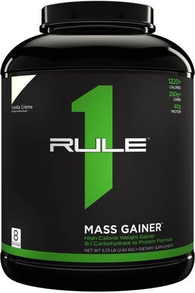 Rule One Mass Gainer protein powder in black tub with green accents, designed for muscle gain and recovery.