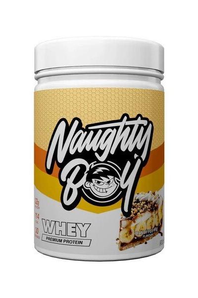 Naughty Boy Advanced Whey protein powder jar with vibrant branding and nutritional information on the label.