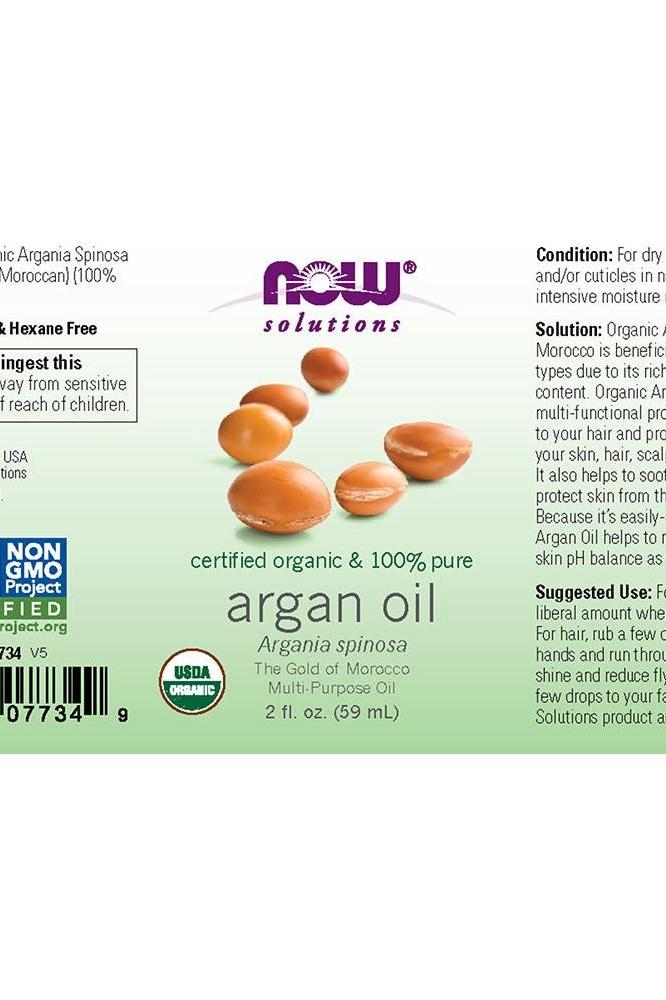 NOW Solutions organic argan oil label, showcasing certified pure product and usage instructions for skin and hair benefits.