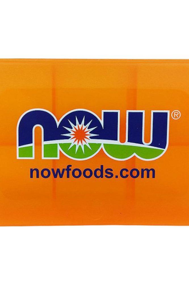 Now Foods pill case in vibrant orange, perfect for organizing daily supplements and easy transport.