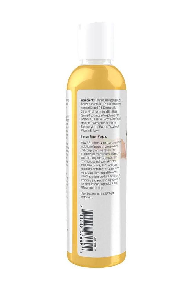 NOW® Tranquil Rose Massage Oil 237 ml bottle showing ingredients and usage instructions on the label.