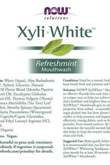 Now Foods XyliWhite Refreshmint Mouthwash label highlighting ingredients and usage instructions.