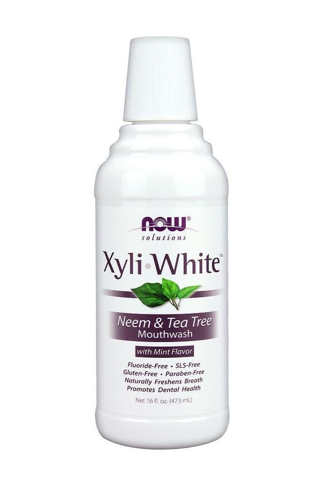 Now Foods XyliWhite Neem & Tea Tree Mouthwash in mint flavor, promoting dental health and fresh breath.