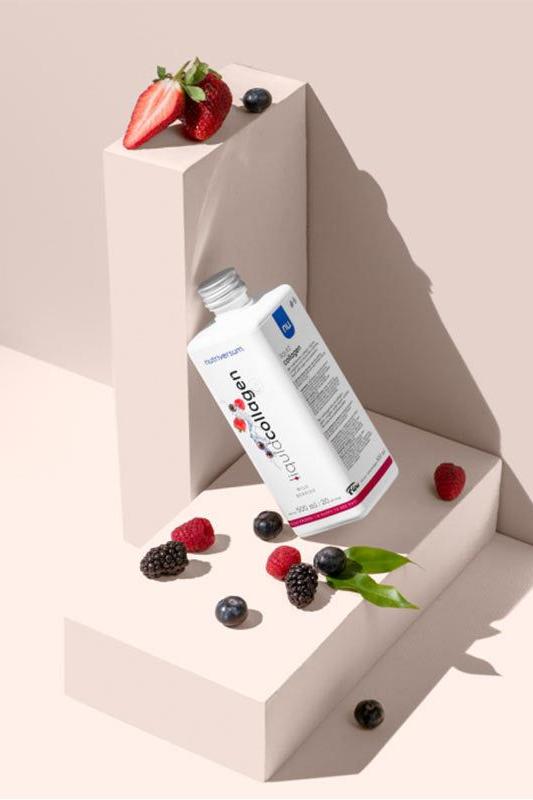 Nutriversum Collagen Liquid with wild berries, promoting skin elasticity and hydration in a stylish display.