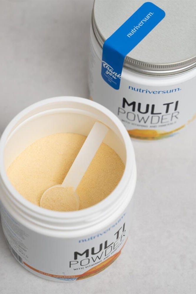 Nutriversum Multi Powder VITA with lemon flavor in a container, promoting immune support and antioxidant benefits.