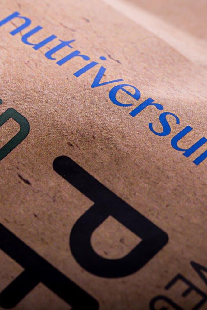 Close-up of Nutriversum packaging showcasing the brand name and logo on a brown paper bag.