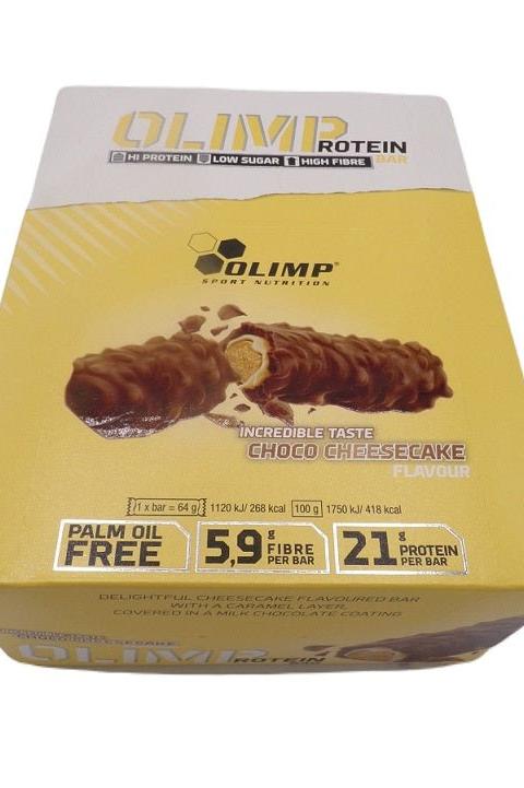 Olimp Protein Bar packaging featuring Choco Cheesecake flavor with nutritional information.