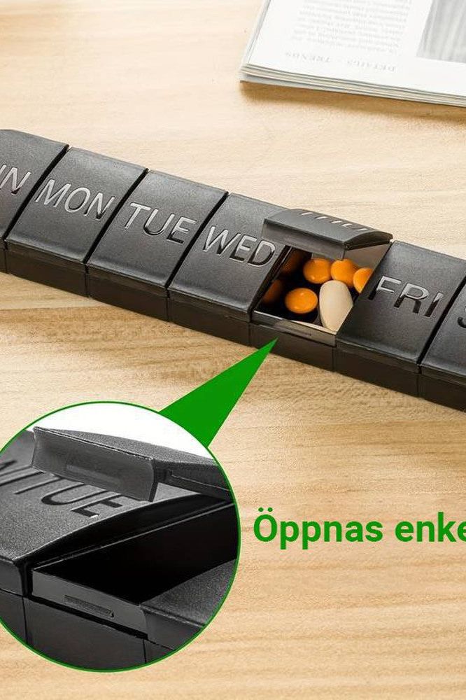 Oly Maxi Pill Box in black with open compartments for organizing weekly medications.