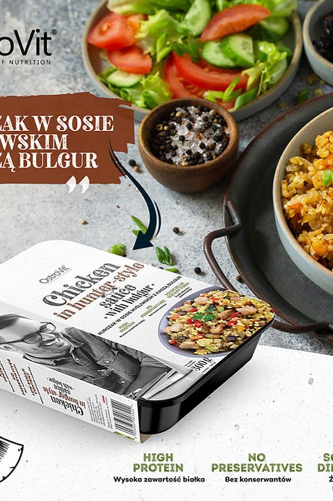 OstroVit chicken dish in hunter-style sauce with bulgur, garnished with fresh vegetables, showcasing high protein content.