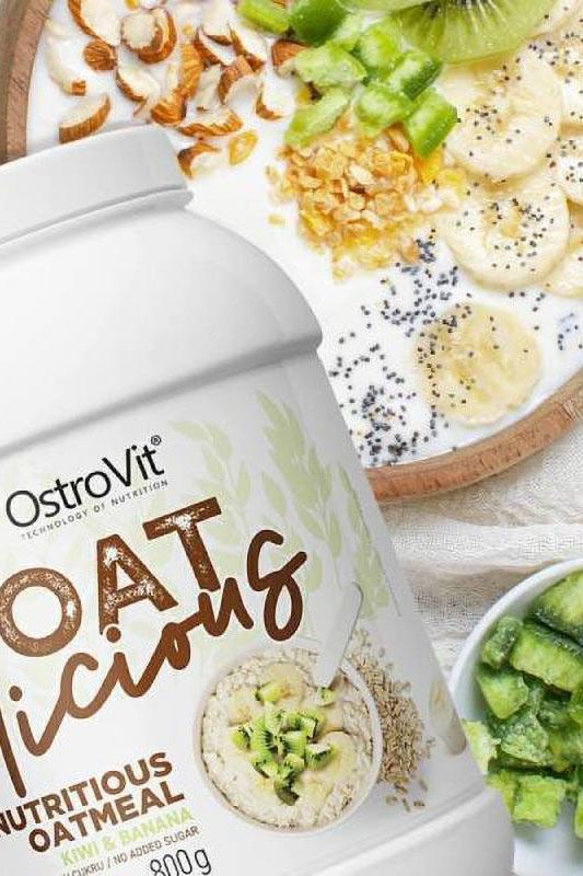 OstroVit OATlicious nutritious oatmeal package with a healthy breakfast bowl featuring fruits and nuts.