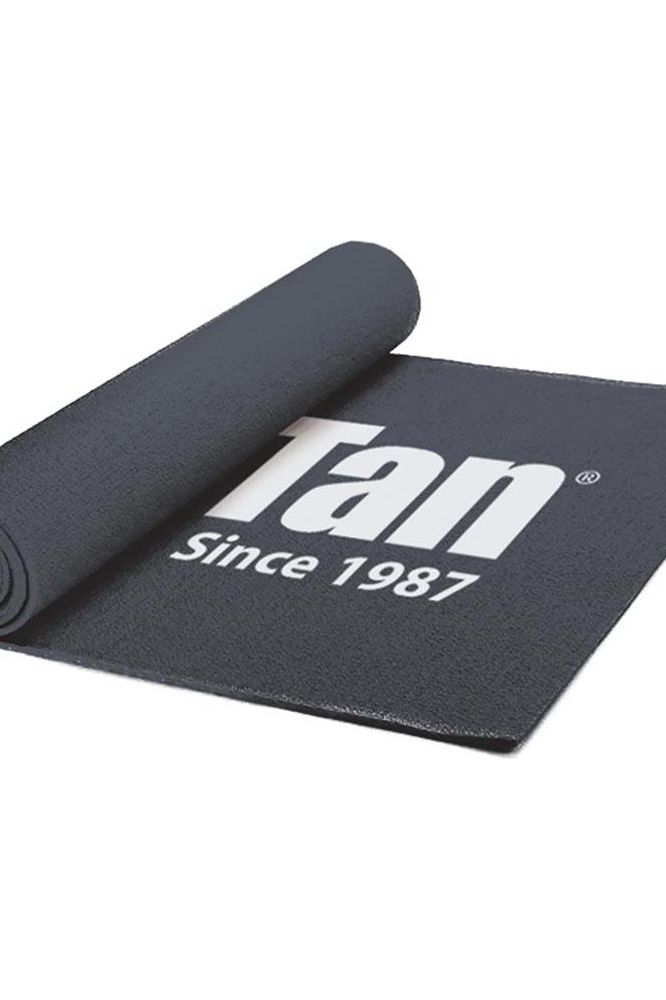 Pro Tan competitor mat, rolled up, featuring logo since 1987, ideal for competitions and workouts.