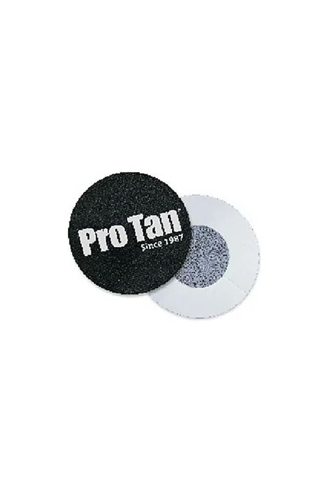 Pro Tan nipple covers, round shape, black with logo, designed for discreet support and comfort during competitions.