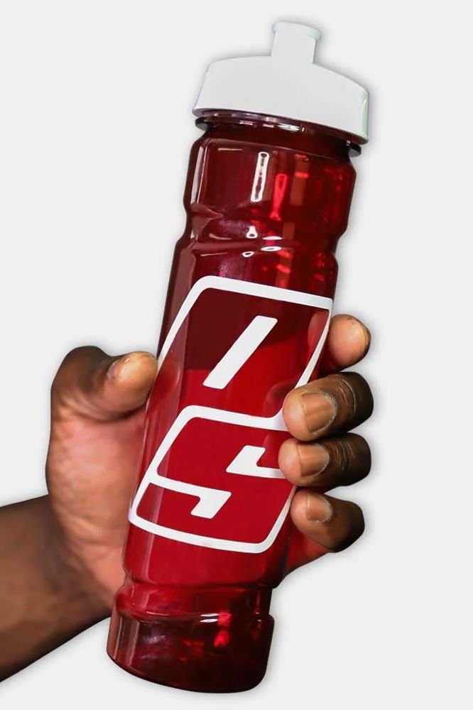 ProSupps Squeeze Water Bottle held in hand, durable design for hydration during workouts, 24 oz capacity.