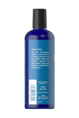 Puritan's Pride Biotin Shampoo bottle with directions for usage on a blue label.