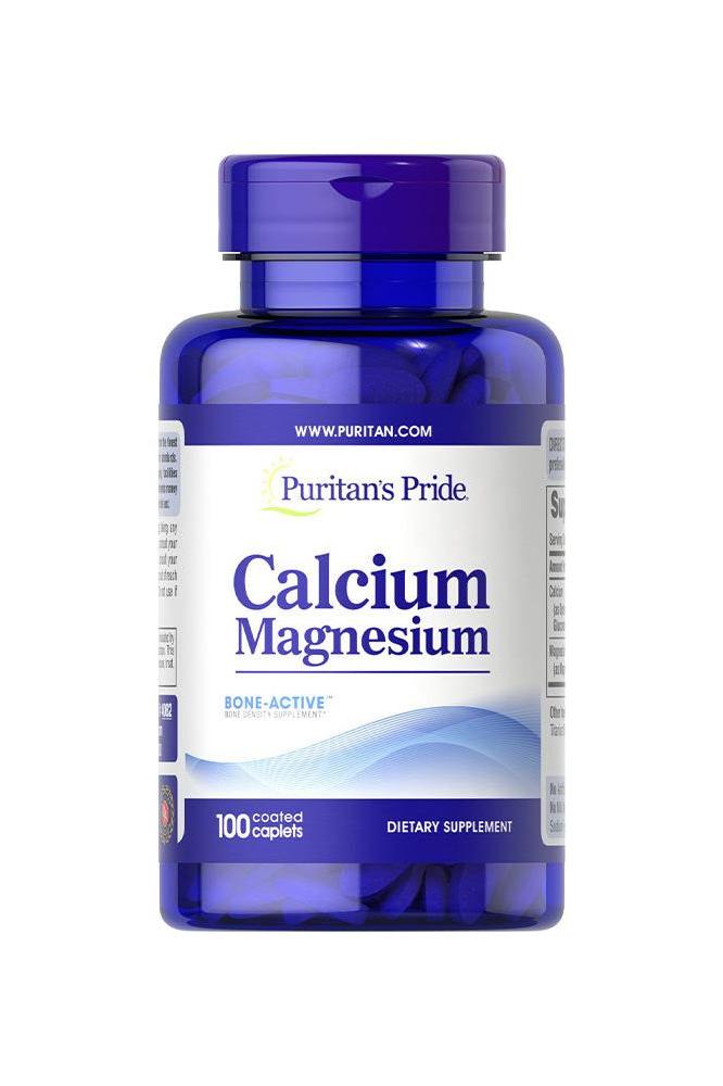 Puritan's Pride Calcium Magnesium supplement bottle with 100 caplets for bone health and muscle support.