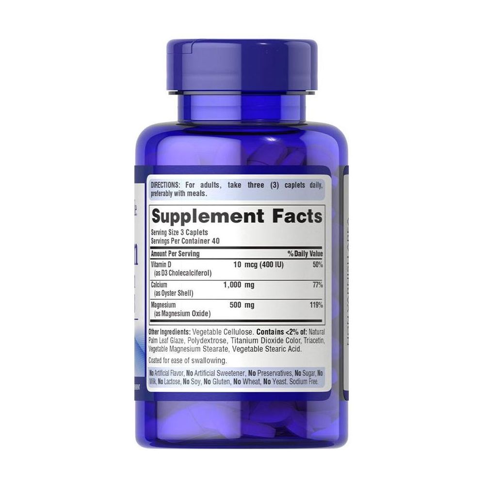 Puritan's Pride Calcium Magnesium with Vitamin D supplement facts label on blue bottle, 120 caplets.