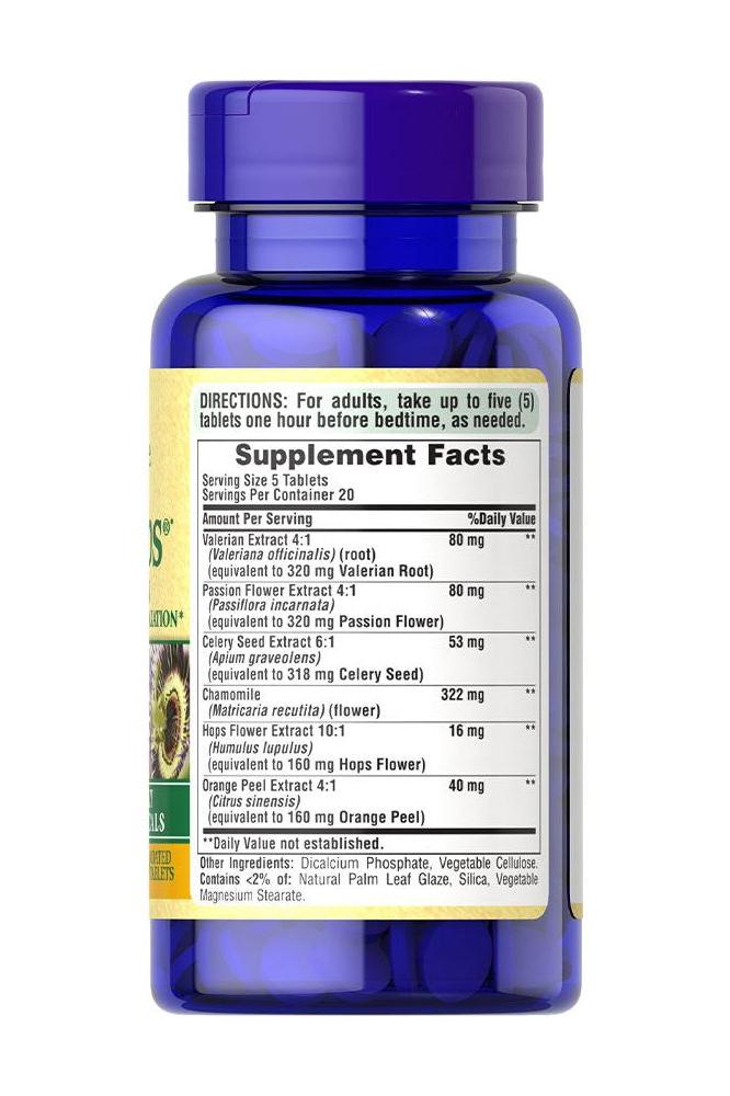 Puritan's Pride Calm Tabs® supplement bottle with ingredients and supplement facts label.