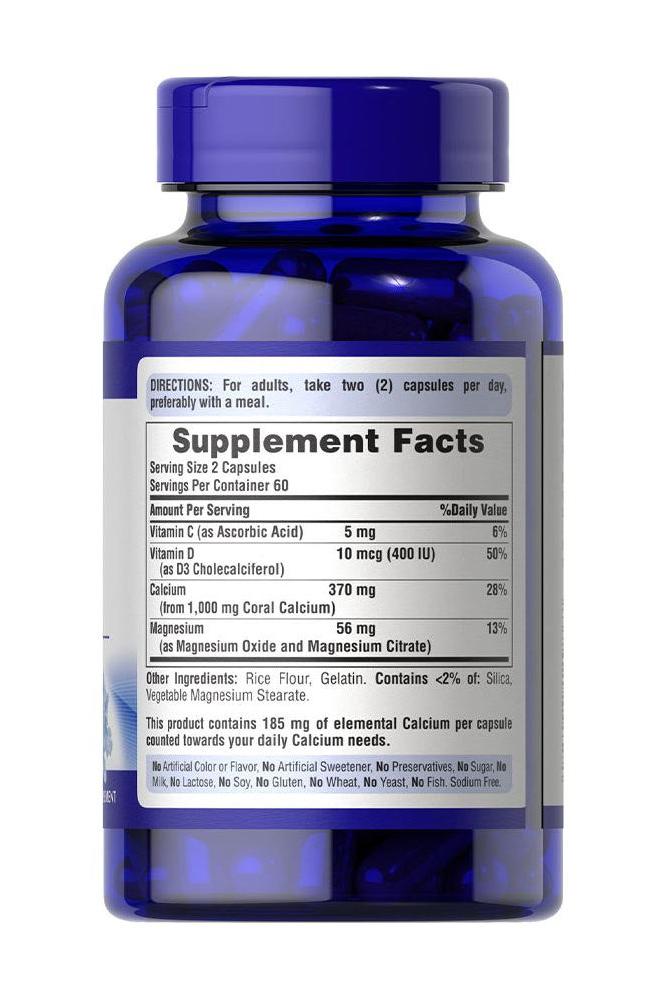 Puritan's Pride Coral Calcium 500 mg supplement bottle with nutritional information and directions.