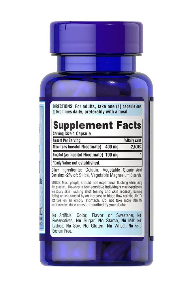 Puritan's Pride Flush Free Niacin 500 mg supplement facts on blue bottle, supporting heart health and energy metabolism.