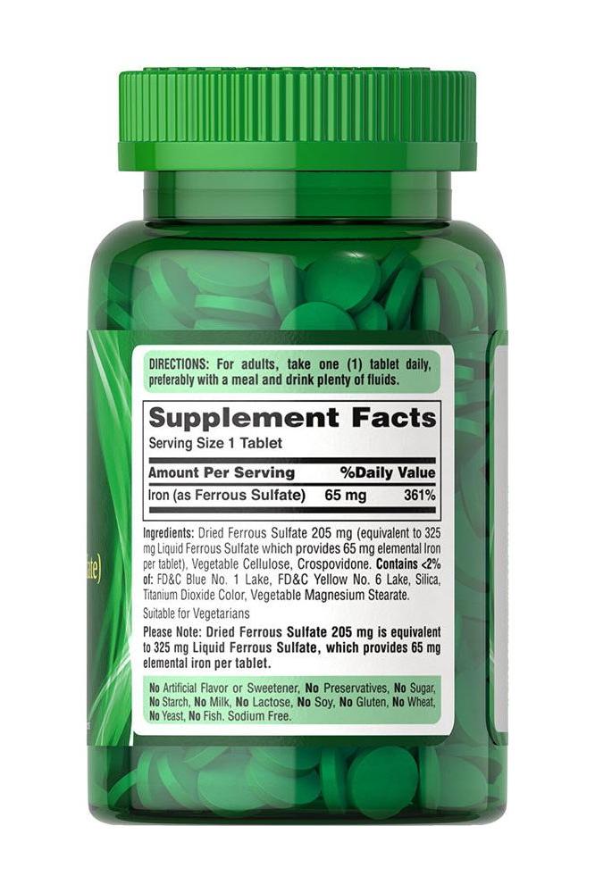 Puritan's Pride Iron 65 mg (Ferrous Sulfate) supplement bottle with green tablets visible.