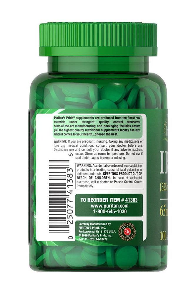 Puritan's Pride Iron 65 mg tablets in green bottle, essential for hemoglobin and energy metabolism.