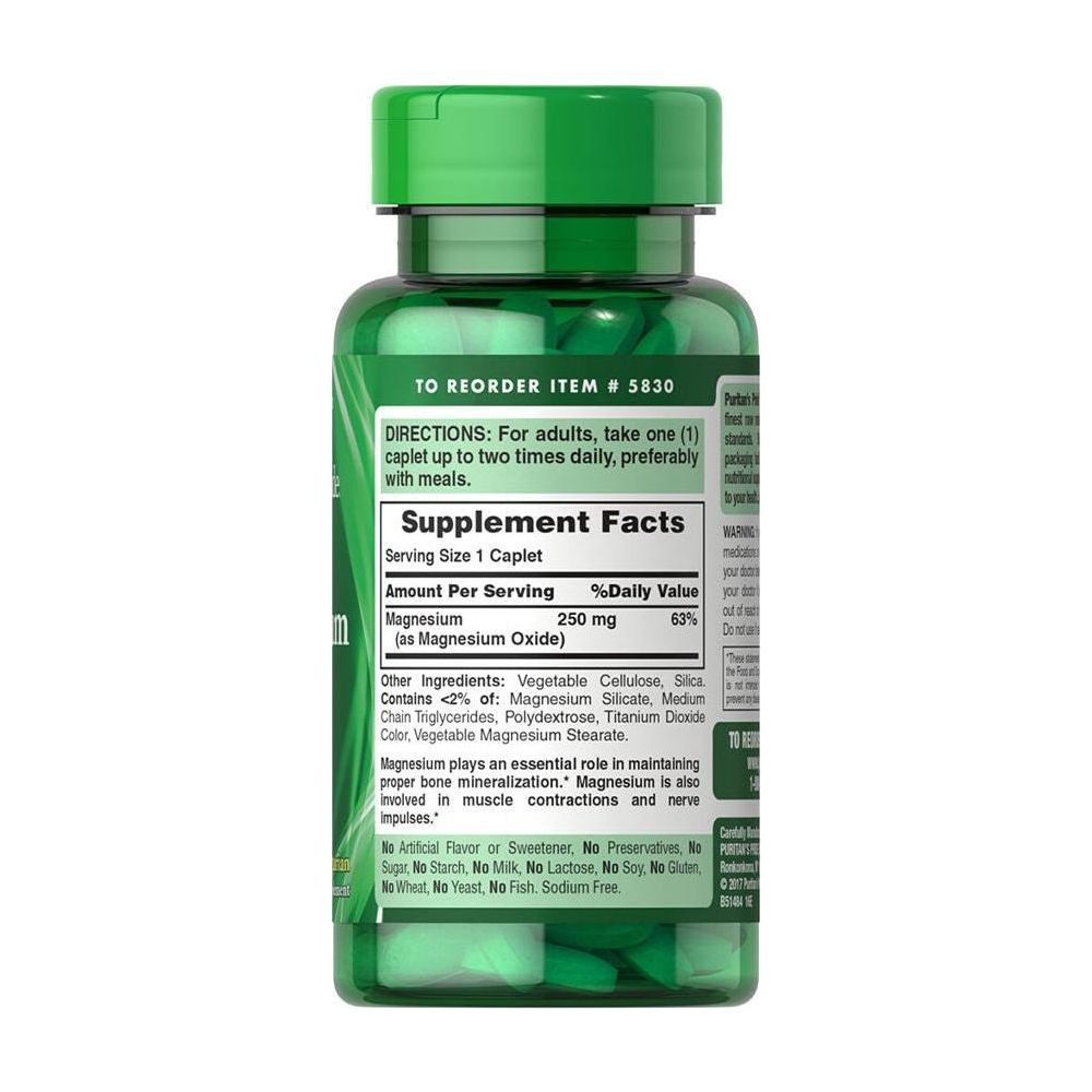 Puritan's Pride Magnesium 250 mg supplement bottle with caplets for bone health and muscle support.