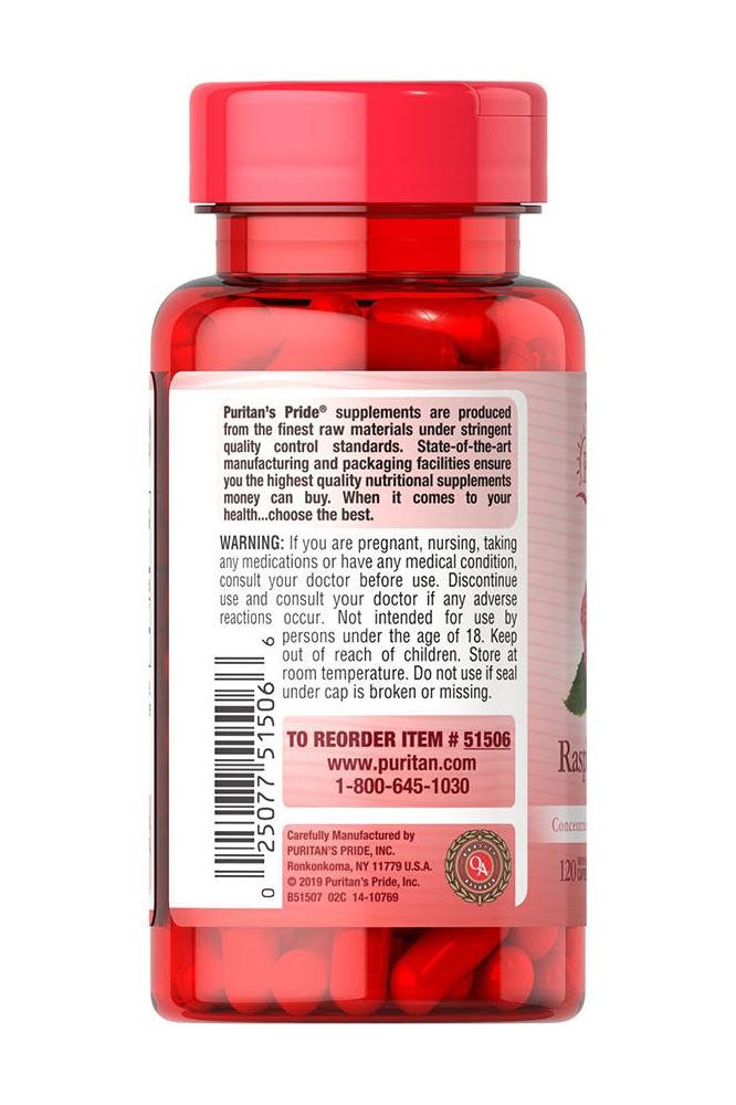 Puritan's Pride Raspberry Ketones 100 mg caplets bottle with supplement information and warning details on the label.